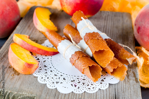 Ripe juicy peach and peach candy pastille photo