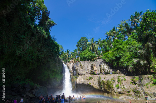 Tegenungan waterfall with blue skies above Kemenuh Village, Sukawati, Gianyar, Bali, Indonesia