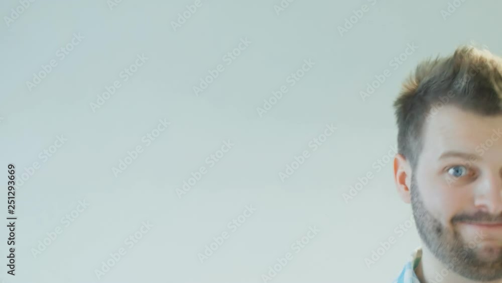 funny amusing and comic man wiggles his eyebrows and moves to the side, facial expression, copy