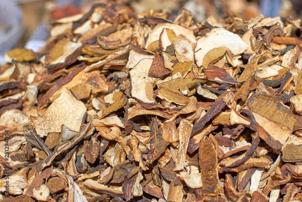 Sliced dried mushrooms on the counter on a sunny day, close-up texture and background Sliced dried mushrooms on the counter on a sunny day, close-up texture and background