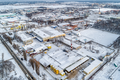 View of the urban industrial district from the air. Winter cityscape.