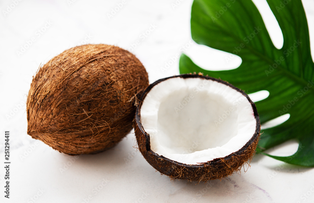 Coconuts with green leaves Coconuts with green leaves