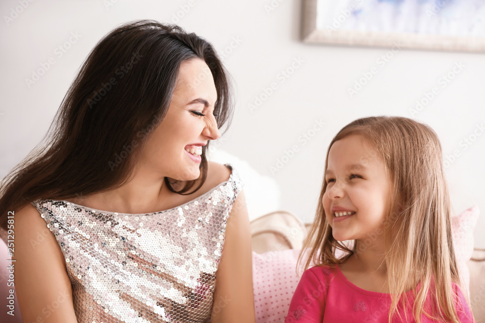 Portrait of cute little girl with mother at home Portrait of cute little girl with mother at home