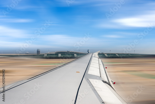Airplane running on the airport runway - Blurred motion