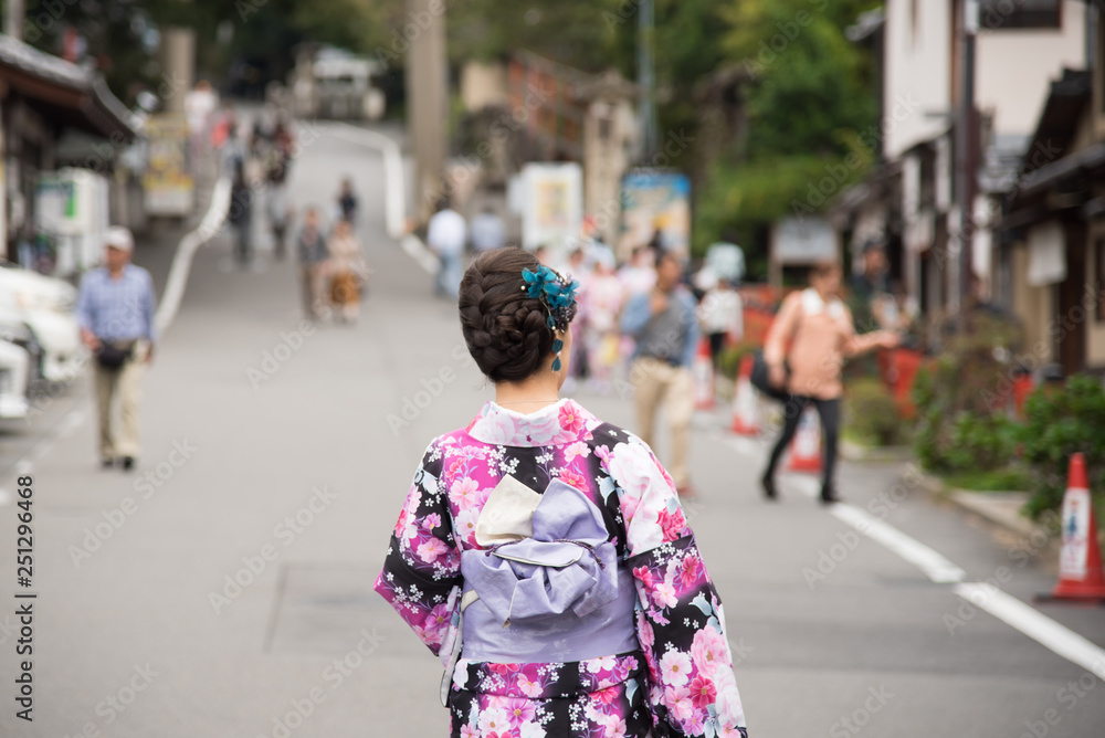 Rear view of unrecognized Japanese girl in a kimono at KIYOMIZU-DERA TEMPLE, Kyoto, Japan Rear view of unrecognized Japanese girl in a kimono at KIYOMIZU-DERA TEMPLE, Kyoto, Japan