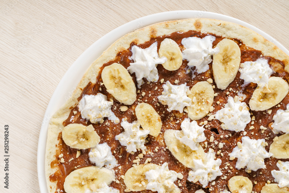 sweet pizza with chocolate paste and bananas sweet pizza with chocolate paste and bananas