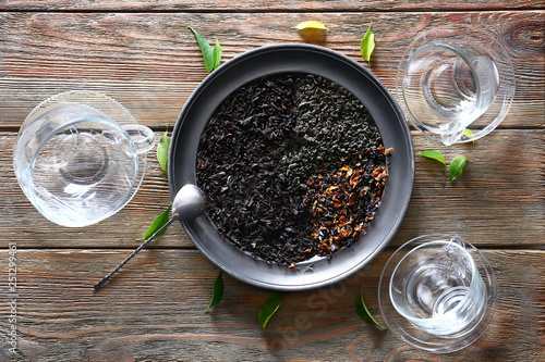 Fototapeta Naklejka Na Ścianę i Meble -  Tray with dry tea leaves on wooden table