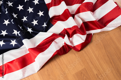 Fototapeta Naklejka Na Ścianę i Meble -  Flag of United States on a wooden table background.
