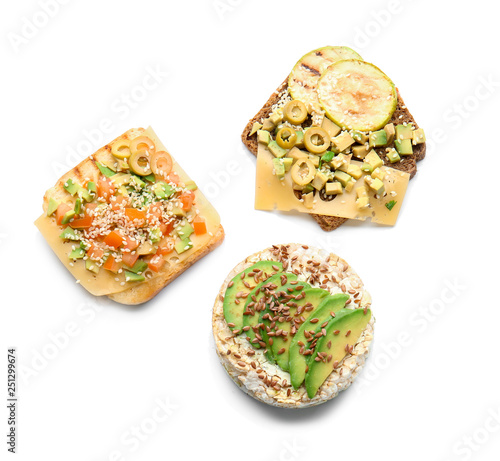 Schilderij op canvas Different tasty sandwiches with avocado on white background