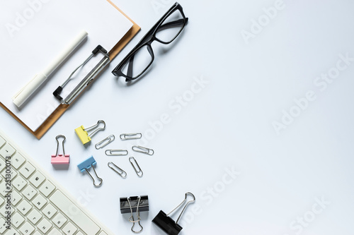 Top view keyboard,notebook,pen,paperclip or object for office on white background.