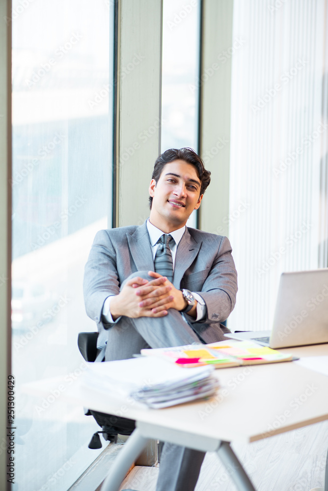 Young successful businessman working at the office Young successful businessman working at the office
