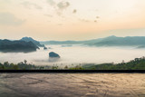 Wooden counter in front of mountain landscape with the sea of mist