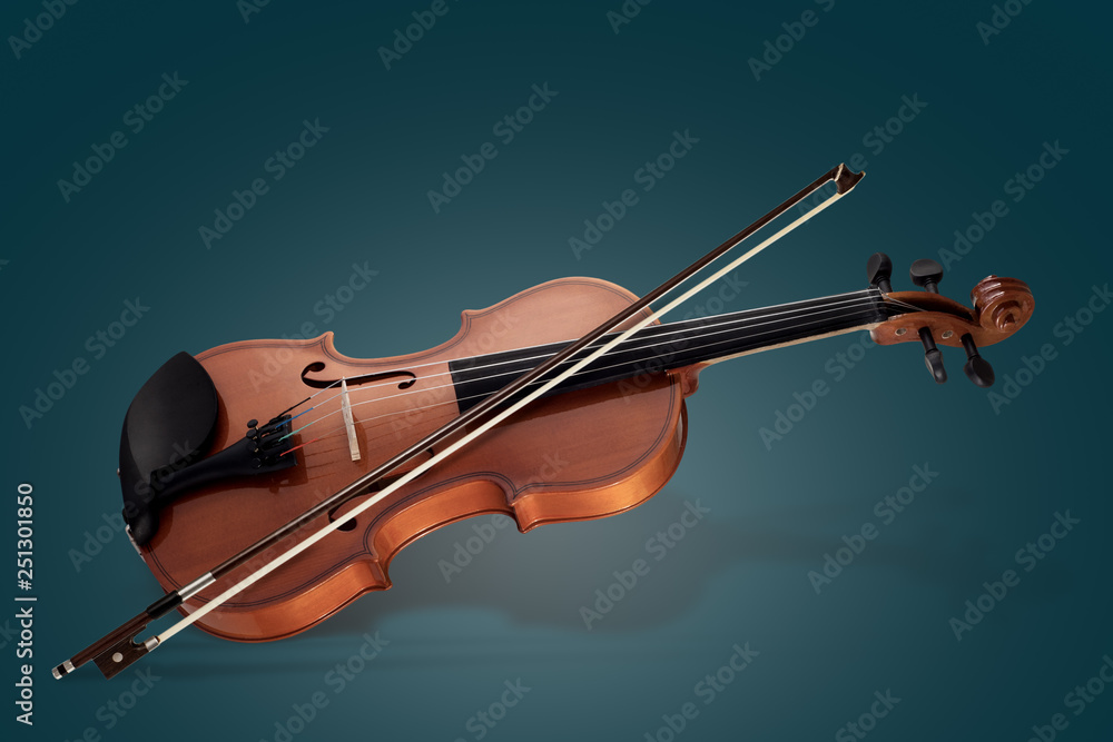 Violin musical instruments of orchestra closeup on blue Violin musical instruments of orchestra closeup on blue