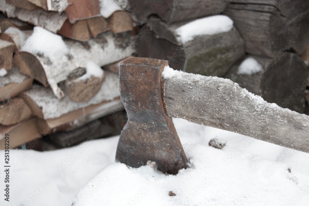 Ax on the background of birch wood Ax on the background of birch wood