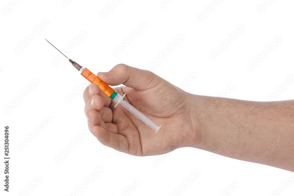 Syringe in hand Syringe in hand