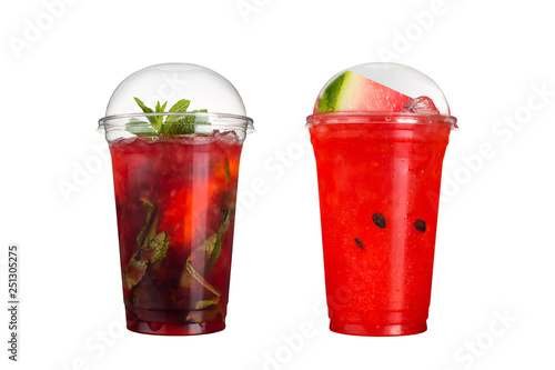 Delicious fruit smoothies in plastic cups  on a white background. Two cocktails with berry and watermelon flavors.