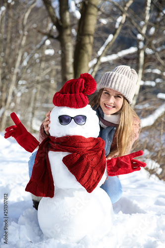 Happy woman with funny snow...