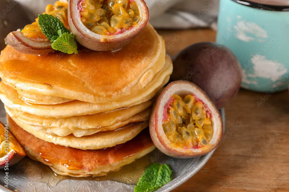 Tasty pancakes with passion fruit on table Tasty pancakes with passion fruit on table