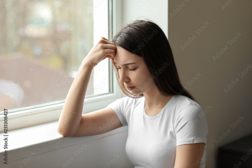 Young depressed woman thinking about suicide at home Young depressed woman thinking about suicide at home
