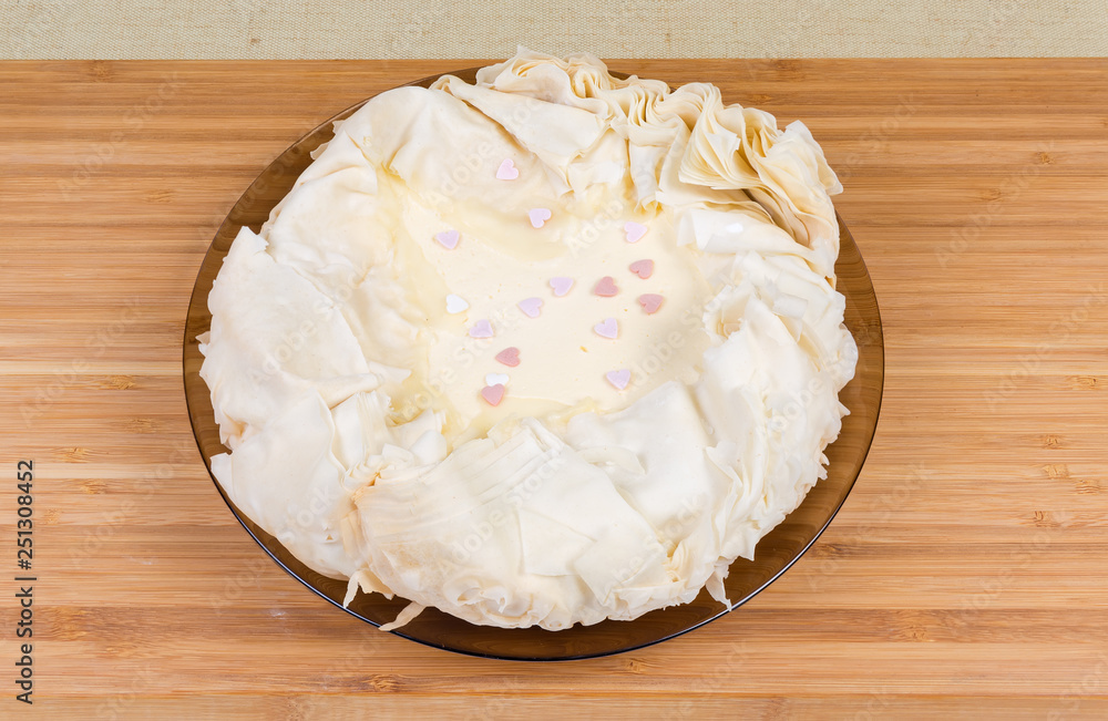 Baked cheesecake with a base of multi-layered sheet dough Baked cheesecake with a base of multi-layered sheet dough