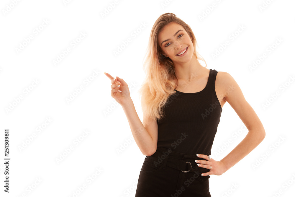 Beautiful young woman point in copy space as she presents new idea or product isolated over white background