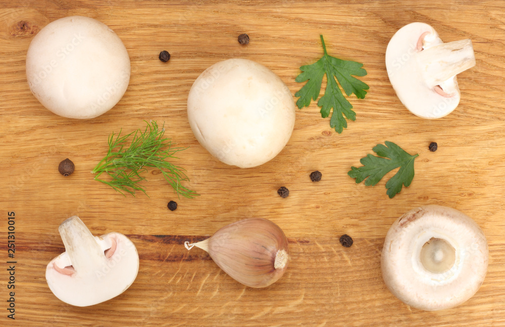 Mushrooms isolated on wooden background. top view. Flat lay. Mushrooms isolated on wooden background. top view. Flat lay.