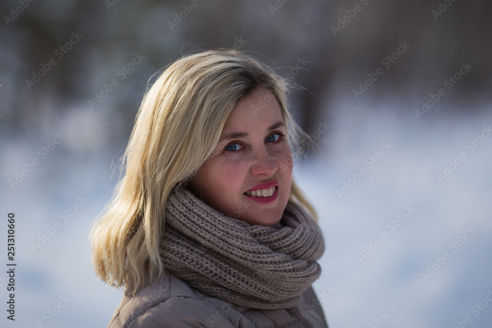 Portrait of a smiling woman in a winter park Portrait of a smiling woman in a winter park