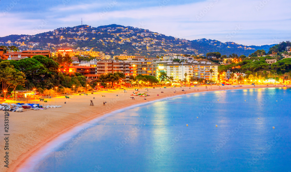 Lloret de Mar resort town skyline in the evening on Costa Brava in Catalonia, Spain.