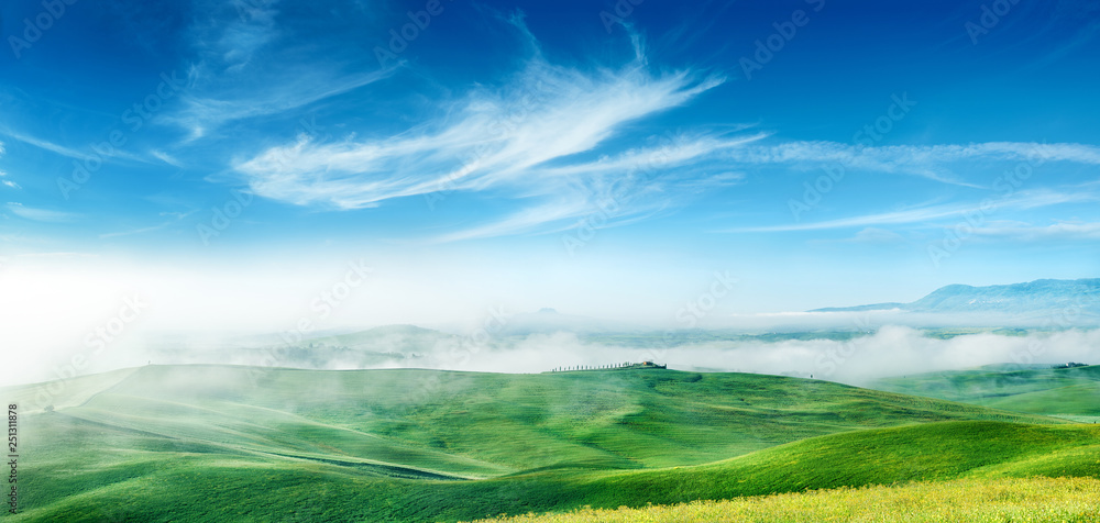 Idyllic view, foggy Tuscan hills at sunrise Idyllic view, foggy Tuscan hills at sunrise