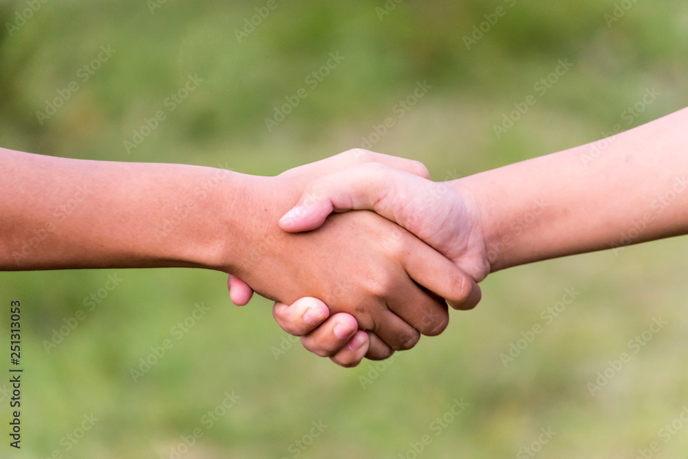 Closeup of people shaking hands Closeup of people shaking hands