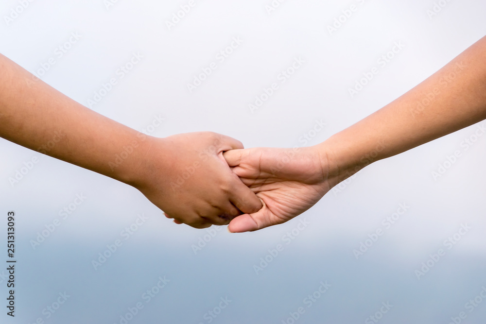 Two woman holding their hands Two woman holding their hands