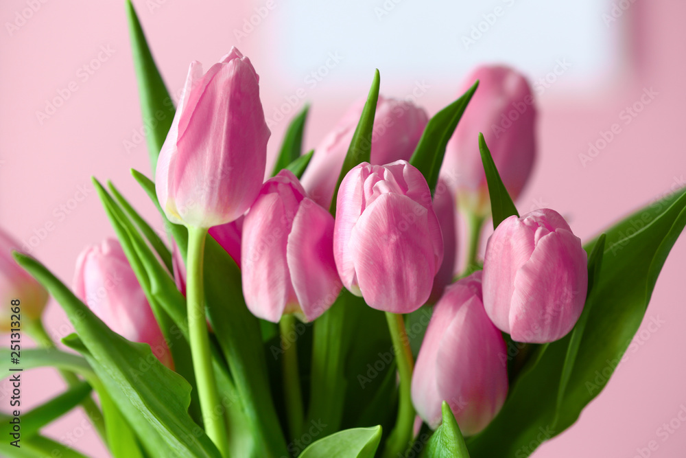 Fototapeta premium Bouquet of beautiful tulips on color background