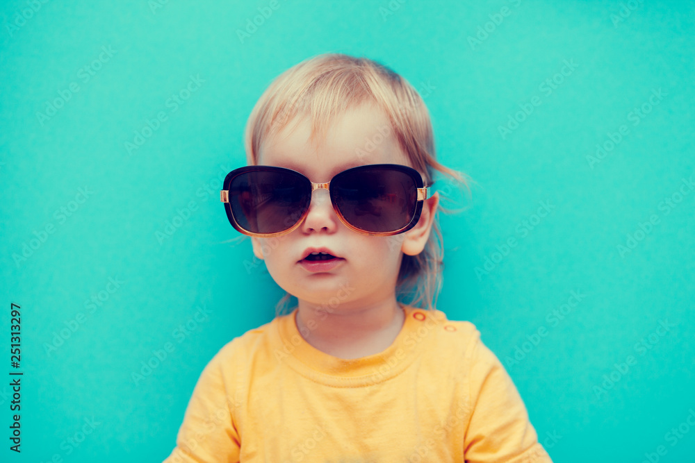 girl in yellow t-shirt and dark glasses girl in yellow t-shirt and dark glasses
