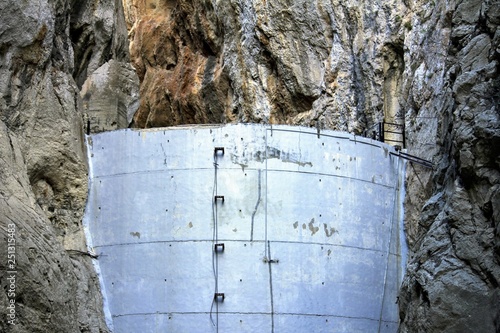 Dam of Isbert, a small unfinished dam, in a empty and dry lake, Barranc de l’Infern, The Hell’s Ravine, in Orba and Vall de Laguar, Alicante, Spain photo