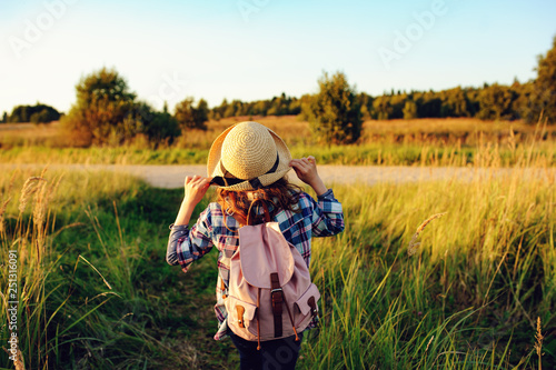 happy child girl walking on summer countryside. Rural living, exploring new places and freedom concept