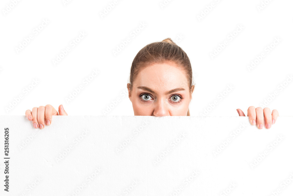 Beautiful businesswoman behind white blank billboard isolated on white background Beautiful businesswoman behind white blank billboard isolated on white background