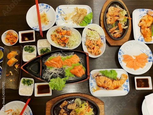 Japanese food style, Top view of shrimp steak, buta steak, sushi, shrimp salad, teriyaki sauce, salmon slice and rice on the table, japan food set in Restaurant