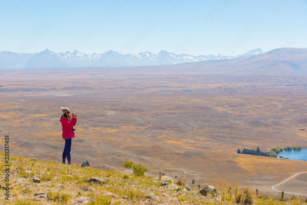 Asian woman travel enjoy at lake Tekapo in New Zealand , Travel Destinations Concept