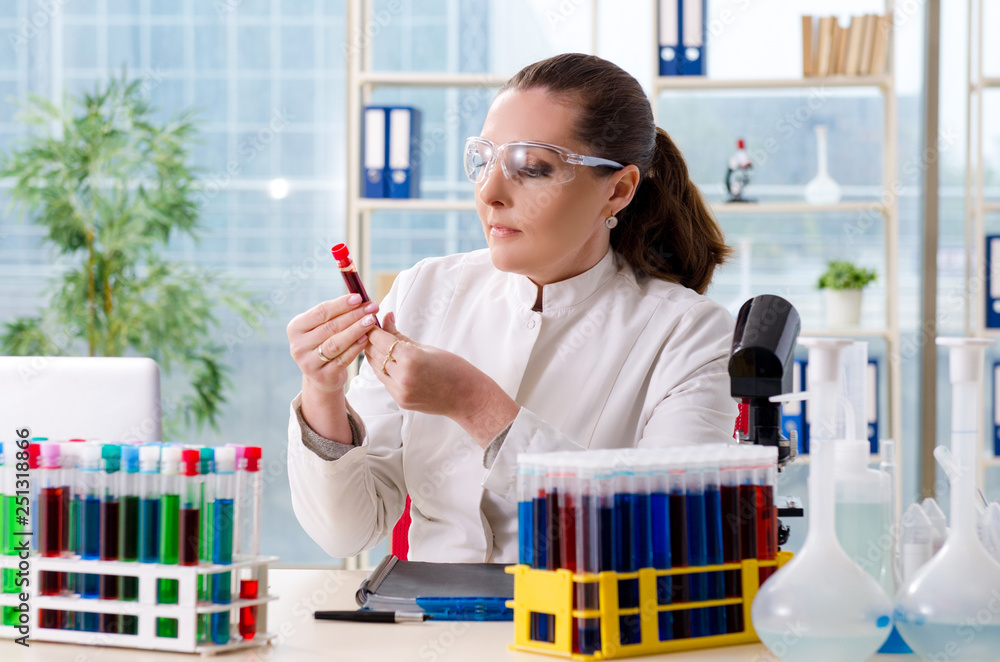 Female chemist working in medical lab Female chemist working in medical lab
