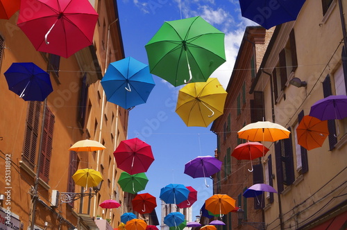 Giuseppe Mazzini street with hanging umbrellas, Ferrara, Italy photo