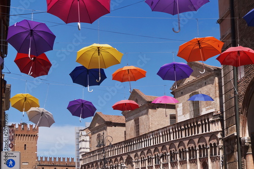 Fototapeta Naklejka Na Ścianę i Meble -  Giuseppe Mazzini street with hanging umbrellas, Ferrara, Italy
