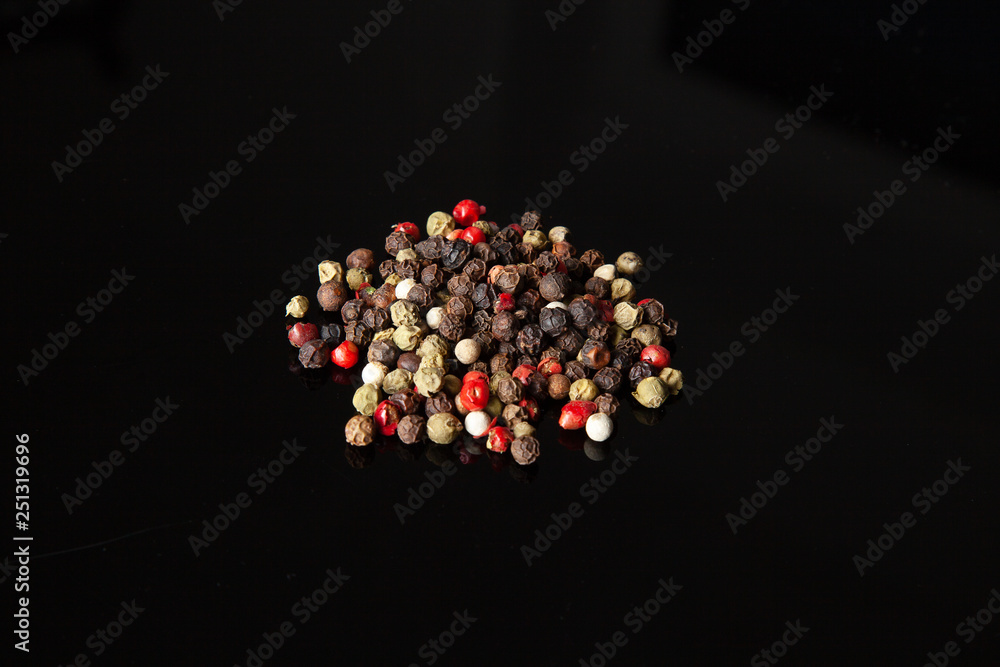 Close up view on black pepper isolated on black background. Spices. Useful image for desgn with copy space Close up view on black pepper isolated on black background. Spices. Useful image for desgn with copy space