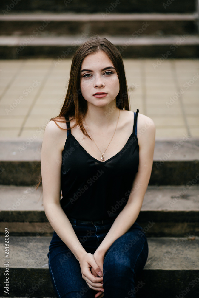 young girl posing on a street in the city