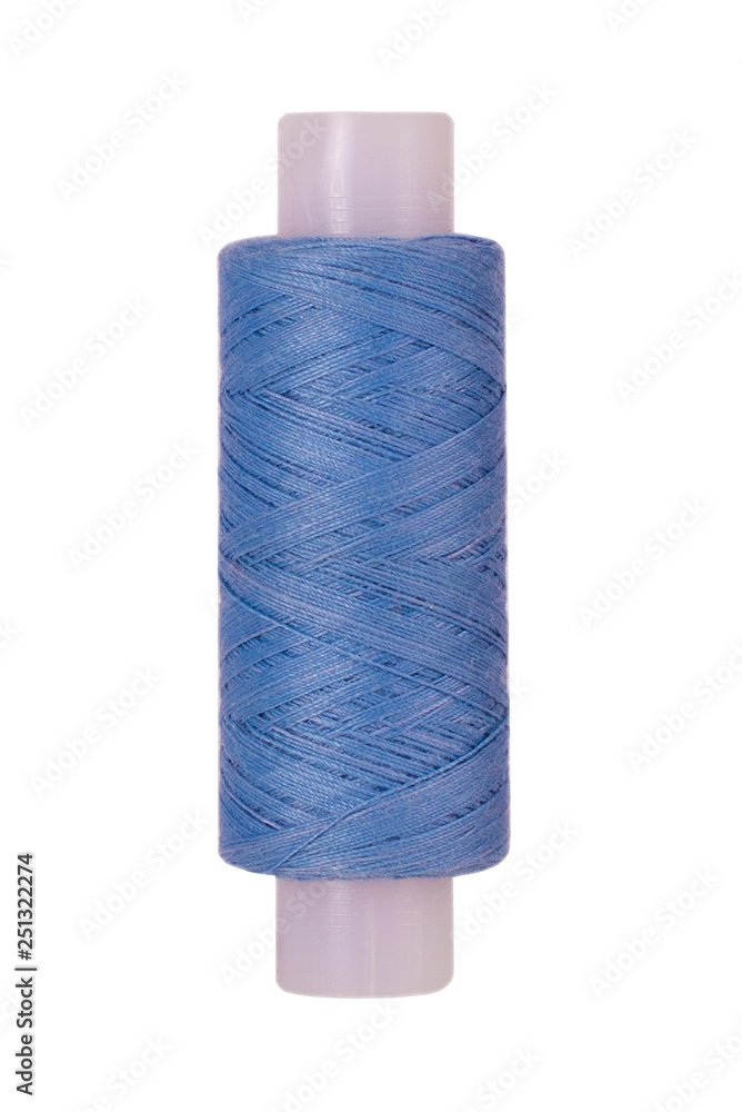 Light blue sewing thread reel on white isolated background Light blue sewing thread reel on white isolated background