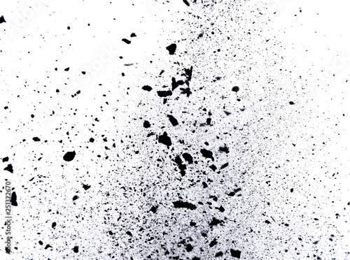 Black powder explosion on black background. Freeze motion.