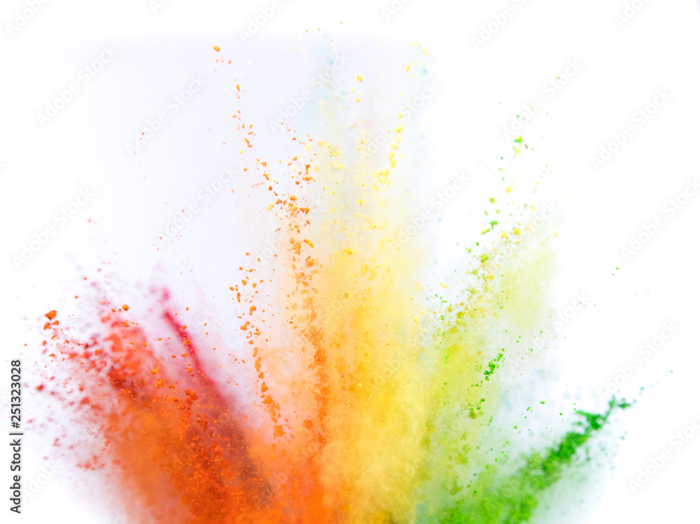 Colored powder explosion on white background. Freeze motion.
