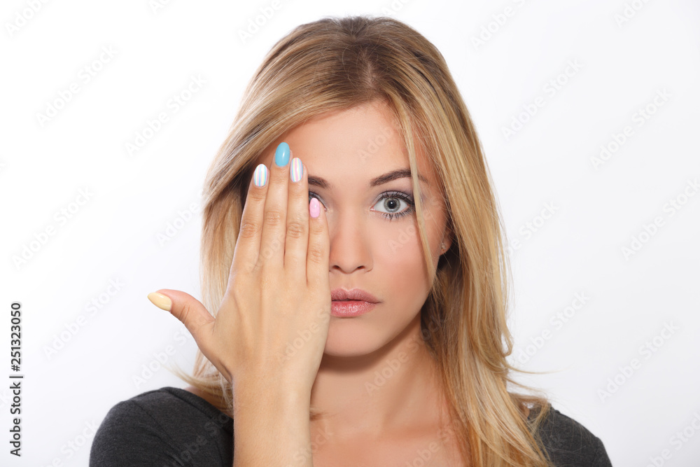 A young beautiful girl covered her face with her palm A young beautiful girl covered her face with her palm