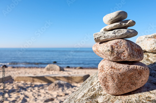 Stack of stones on a beach, balance and harmony concept, selective focus.