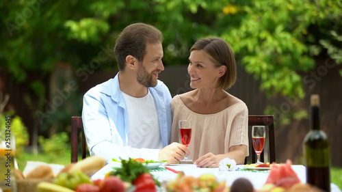 Middle-aged couple celebrating anniversary  remembering youth and dating time
