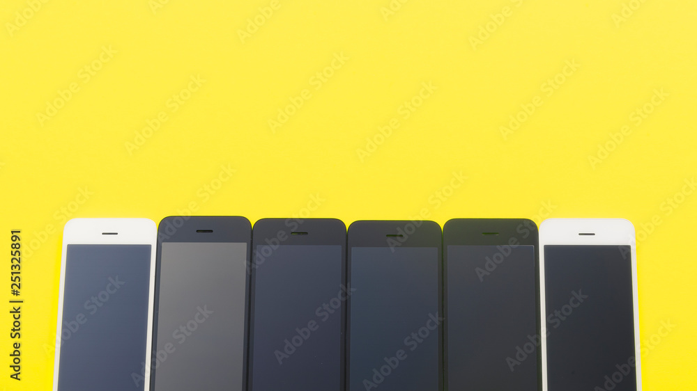 Black and white screens on a yellow background. Mock-up Black and white screens on a yellow background. Mock-up